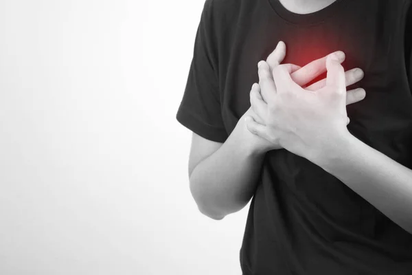 Asian people have a heart attack on a white background. Isolated — Stock Photo, Image