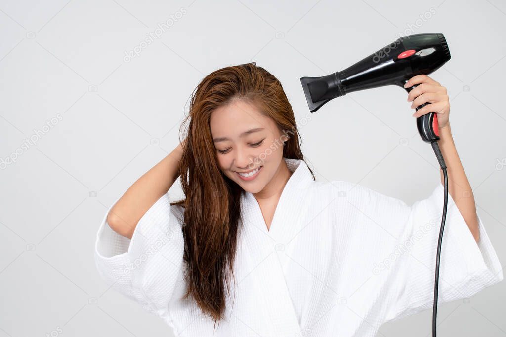 Asian women drying their hair after showering.