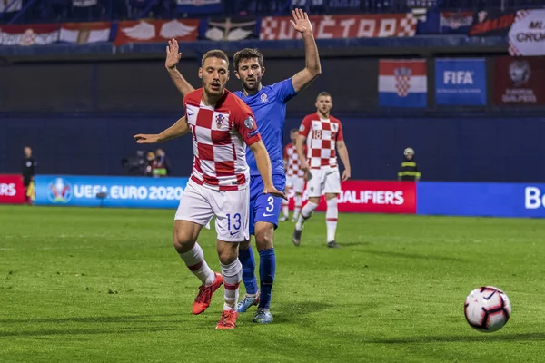 Zagreb, Hırvatistan - 21 Mart 2019: Uefa Euro 2020 Ön eleme turu. Hırvatistan Azerbaycan 'a karşı. Eylemde Nikola Vlasiç (13) ve Şahriyar Rahimov (3))