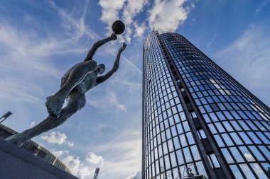 ZAGREB, CROATIA - MAY 09, 2018: Monument of famous Croatian basketball player Drazen Petrovic and Cibona business tower in background