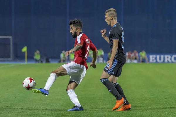 ZAGREB, CROATIA - JULY 24, 2018: UEFA Champions League match between GNK Dinamo Zagreb and Hapoel Beer-Sheva FC (5-0). In action Ben BITTON (2) and Mislav ORSIC (99)