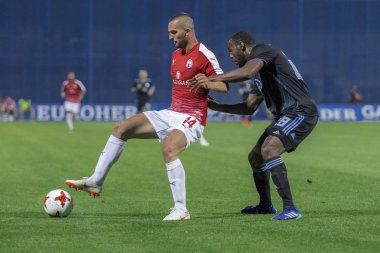 ZAGREB, CROATIA - JULY 24, 2018: UEFA Champions League match between GNK Dinamo Zagreb and Hapoel Beer-Sheva FC (5-0). In action Ben SAHAR (14) and Kevin THEOPHILE-CATHERINE (28)