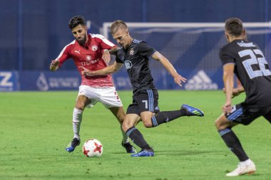 ZAGREB, CROATIA - JULY 24, 2018: UEFA Champions League match between GNK Dinamo Zagreb and Hapoel Beer-Sheva FC (5-0). In action Dani OLMO (7) and Ben BITTON (2)