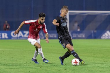 ZAGREB, CROATIA - JULY 24, 2018: UEFA Champions League match between GNK Dinamo Zagreb and Hapoel Beer-Sheva FC (5-0). In action Dani OLMO (7) and Ben BITTON (2)