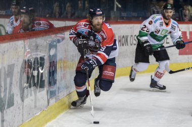 ZAGREB, CROATIA - DECEMBER 28, 2017: EBEL ice hockey league match between Medvescak Zagreb and Graz 99ers. Marko POYHONEN (39) and HIGGS Brock (23) in duel