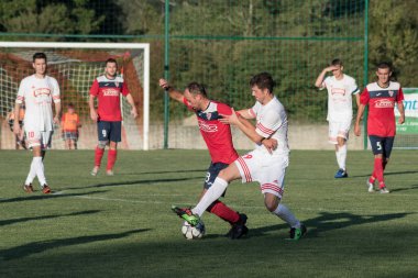 ZELINA, CROATIA - AUGUST 28, 2017:  Croatian Fourth Football League game between NK Croatia and NK Zelina. Unknown football players in action