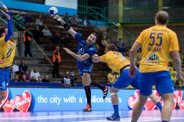 ZAGREB, CROATIA - MARCH 09, 2017: SEHA League PPD Zagreb VS RK Celje Pivovarna Lasko. MANDALINIC Stipe (27) throwing the ball