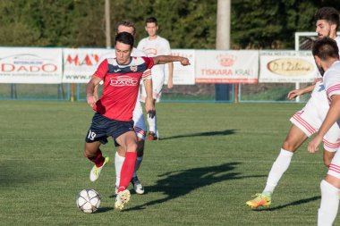 ZELINA, CROATIA - AUGUST 28, 2017:  Croatian Fourth Football League game between NK Croatia and NK Zelina. Unknown football players in action