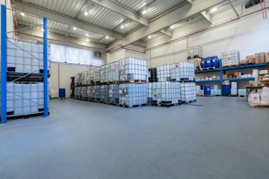 ZAGREB, CROATIA - DECEMBER 21, 2016: Warehouse with chemicals in IBC containers. IBC is used for storage and transport of chemicals.