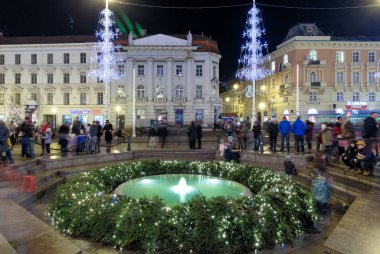 ZAGREB, CROATIA - DECEMBER 27, 2016: Advent in Zagreb, Night photo of Mandusevac fountain decorated with advent wreath. Ban Josip Jelacic square in Zagreb, Croatia.