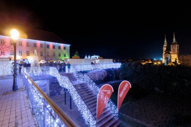 ZAGREB, CROATIA - DECEMBER 27, 2016: Advent in Zagreb plateau Gradec with Christmas stands and stairs decorated with lights. Cathedral in background