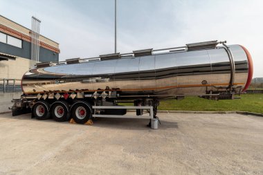 ZAGREB, CROATIA - OCTOBER , 2016: Trailer tank with dangerous flammable goods on parking lot in chemical warehouse