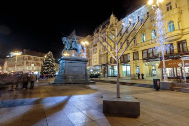 ZAGREB, CROATIA - DECEMBER 27, 2016: Advent in Zagreb, Menorah and Christmas tree on main square of Ban Jelacic in Zagreb, croatia