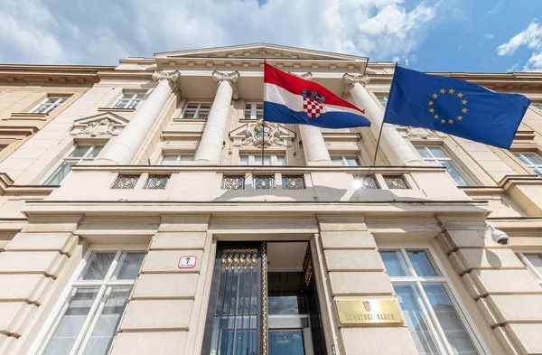 ZAGREB, CROATIA - MAY 07, 2016: Croatian and European flag's blowing in the wind on the Croatian parliament building