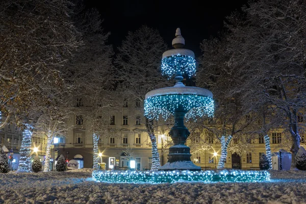 Zrinjevac Fountain decorated by Christmas lights as part of Advent in Zagreb. Fountain is  known as The Mushroom.
