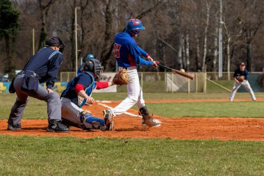 ZAGREB, CROATIA - MARCH 12, 2017: Baseball Klub Zagreb vs. Olimpija Karlovac. Batter hits the ball, ball on the bat