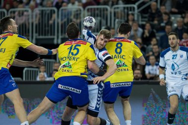 ZAGREB, CROATIA - MARCH 09, 2017: EHF Champions League PPD Zagreb VS RK Celje Pivovarna Lasko. Player going through human wall