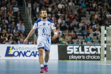 ZAGREB, CROATIA - MARCH 09, 2017: EHF Champions League PPD Zagreb VS RK Celje Pivovarna Lasko. HORVAT Zlatko (18) looking at the score screen