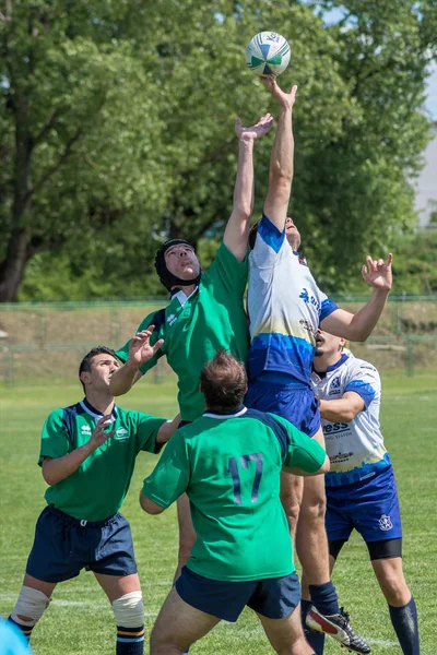 ZAGREB, CROATIA - MAY 6, 2017: Zagreb 7's - Rugby Tournament. Rugby players jump for the ball