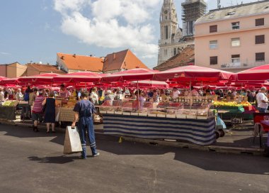 ZAGREB, CROATIA - AUGUST 26, 2015: Customers and sellers at Dolac, the famous open air farmer's market of agricultural products in Zagreb, one of city's most notable landmarks.