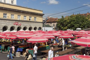 ZAGREB, CROATIA - AUGUST 26, 2015: Customers and sellers at Dolac, the famous open air farmer's market of agricultural products in Zagreb, one of city's most notable landmarks.