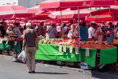 ZAGREB, CROATIA - AUGUST 26, 2015: Customers and sellers at Dolac, the famous open air farmer's market of agricultural products in Zagreb, one of city's most notable landmarks.