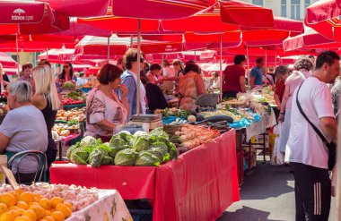 ZAGREB, CROATIA - AUGUST 26, 2015: Customers and sellers at Dolac, the famous open air farmer's market of agricultural products in Zagreb, one of city's most notable landmarks.