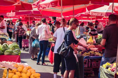 ZAGREB, CROATIA - AUGUST 26, 2015: Customers and sellers at Dolac, the famous open air farmer's market of agricultural products in Zagreb, one of city's most notable landmarks.