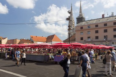 ZAGREB, CROATIA - AUGUST 26, 2015: Customers and sellers at Dolac, the famous open air farmer's market of agricultural products in Zagreb, one of city's most notable landmarks.