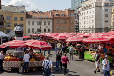 ZAGREB, CROATIA - AUGUST 26, 2015: Customers and sellers at Dolac, the famous open air farmer's market of agricultural products in Zagreb, one of city's most notable landmarks.