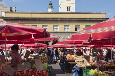 ZAGREB, CROATIA - AUGUST 26, 2015: Customers and sellers at Dolac, the famous open air farmer's market of agricultural products in Zagreb, one of city's most notable landmarks.