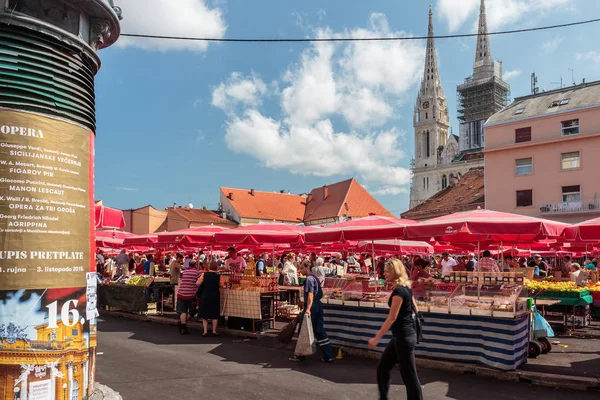 ZAGREB, CROATIA - AUGUST 26, 2015: Customers and sellers at Dolac, the famous open air farmer's market of agricultural products in Zagreb, one of city's most notable landmarks.