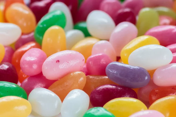 Jelly beans on white background close up