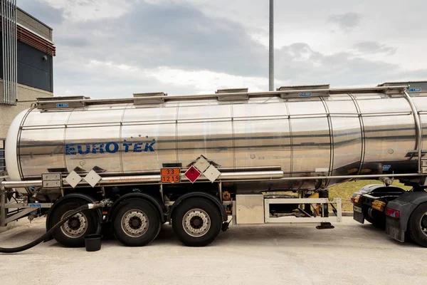 ZAGREB, CROATIA - JUNE 23, 2015: Tank truck unloading dangerous flammable goods Isopropyl alcohol into the inner tank storage of chemicals warehouse