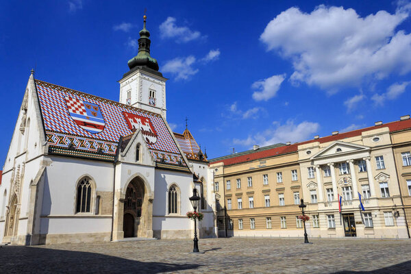 Croatian coat of arms colored roof tiles of saint Mark's church and Croatian parliament at St. Mark's Square, Zagreb, Croatia.