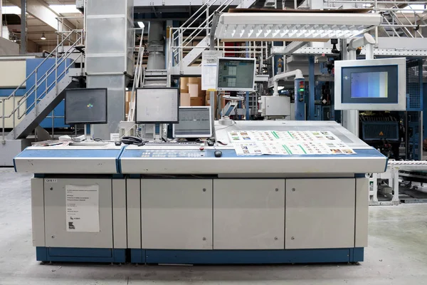 ZAGREB, CROATIA - SEPTEMBER 16, 2014: View of rotation Koenig Bauer machine in Printing house. The control desk of the printing press.