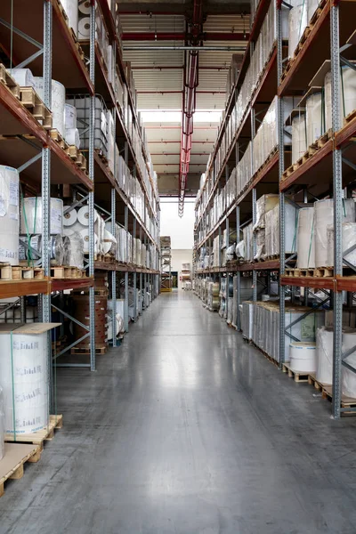 ZAGREB, CROATIA - SEPTEMBER 16, 2014: Printing house storage of goods in a modern warehouse. Large presses have a need for a continuous supply of materials needed for printing