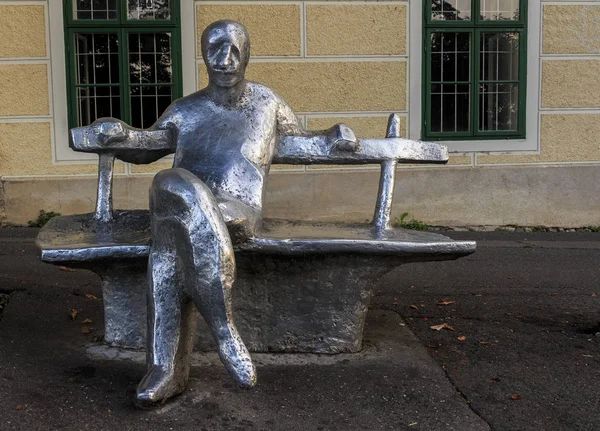 ZAGREB, CROATIA - AUGUST 08, 2014: Strossmayer promenade with metal statue of Antun Gustav Matos, one of Croatia's most famous writers made by Ivan Kozaric