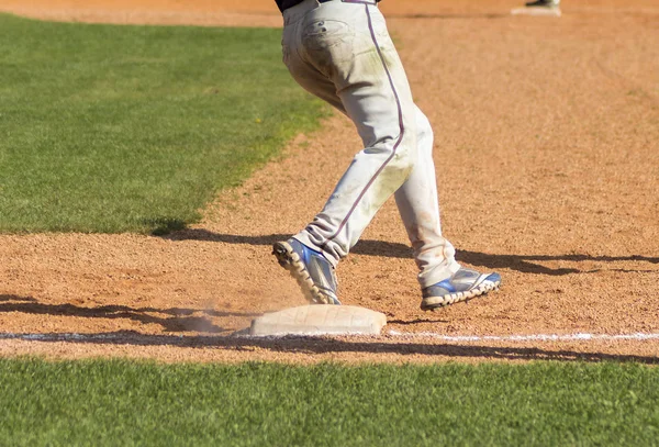 ZAGREB. CROATIA - OCTOBER 12, 2014: Baseball match Baseball Club Zagreb in blue jersey and Baseball Club Olimpija in dark blue jersey. Unidentified baseball player stepped on the base