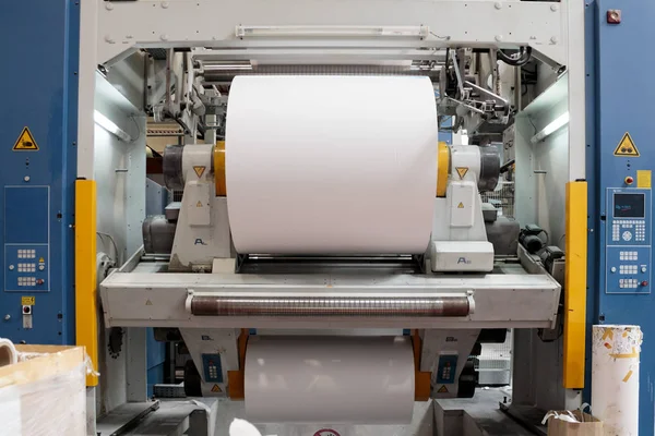 ZAGREB, CROATIA - SEPTEMBER 16, 2014: View of rotation Koenig Bauer machine in Printing house. Part of machine that is called the star, it changes rolls of paper continuously.
