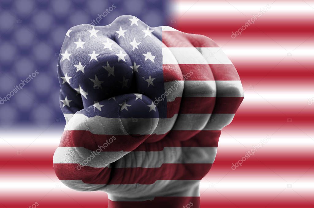 American flag on fist and American flag background