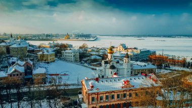 Russian winter landscape with a view of the confluence of the Oka and Volga rivers and cathedrals in Nizhny Novgorod clipart
