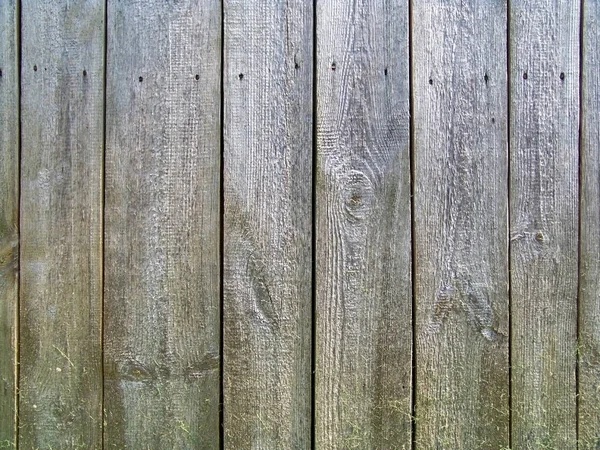 Achtergrond van houten oude planken vastgenageld aan de straat — Stockfoto