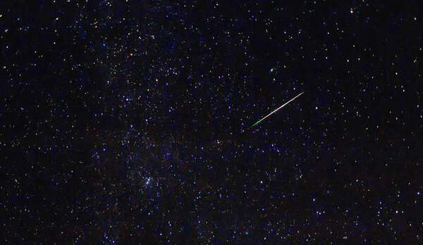 Meteor. Perseid meteor shower. Night sky stars and meteors