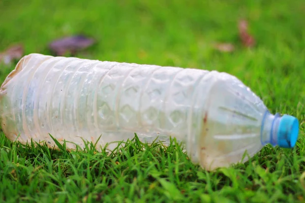 Plastic pollution - Plastic bottle is fallen down in the grass