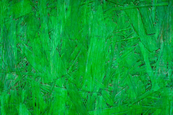 Green paint on a wooden board. Wallpaper, texture