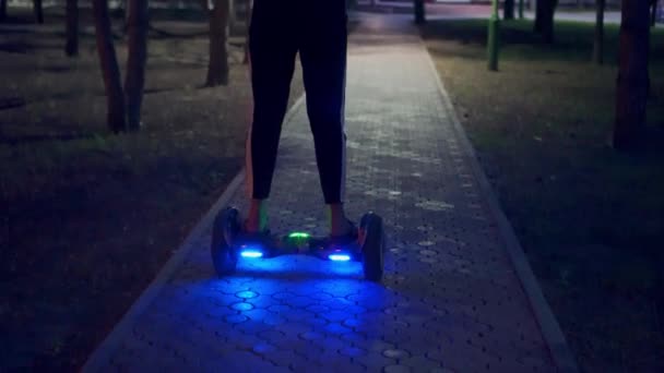 Girl Riding Gyro Scooter Evening Turned Lights Evening Park Leisure — Stock Video