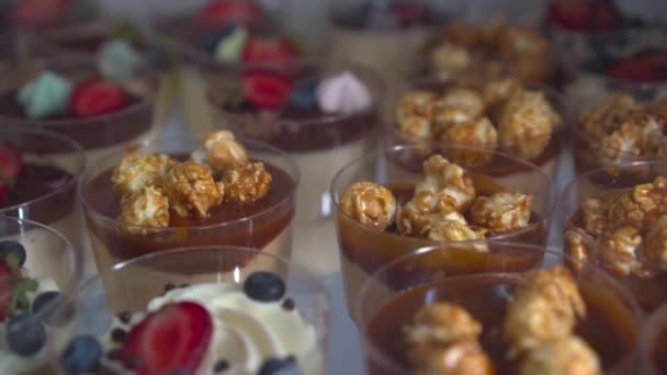 Delicious Cakes Eclairs Window Confectionery Caramel Icing Nuts Berries Chocolate — Stock Video