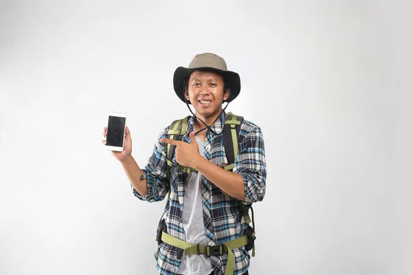 Trekking Isolated Asian Man Pointing Smartphone — Stock Photo, Image