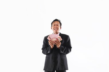 Endonezya 'lı profesyonel Rupiah' ı tutuyor.